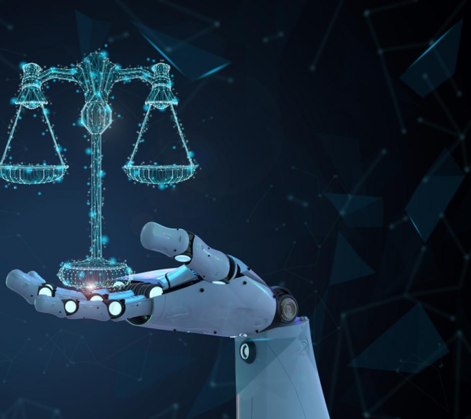 Main de robot tenant une balance symbolisant la loi